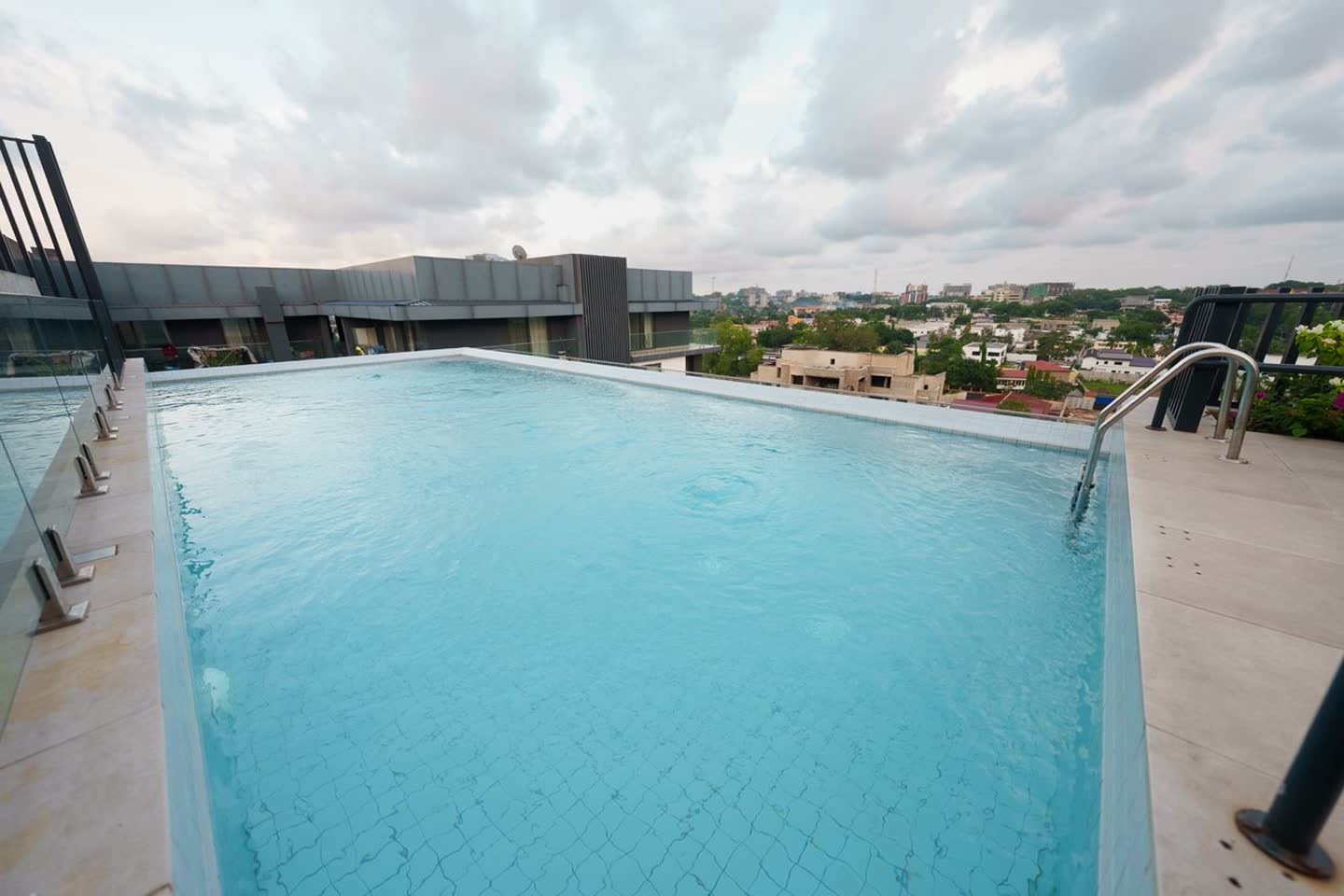 Rooftop infinity pool with open views across Roman Ridge